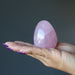 dark pink star rose quartz egg on palm of hand