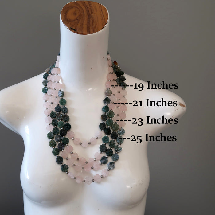 mannequin with multiple rose quartz moss agate flower necklaces