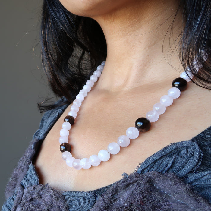 rose quartz and smoky quartz necklace on female neck