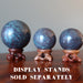3 ruby kyanite spheres on wood display stands, which are sold separately