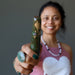 sheila of satin crystals holding ruby zoisite tapered massage wand