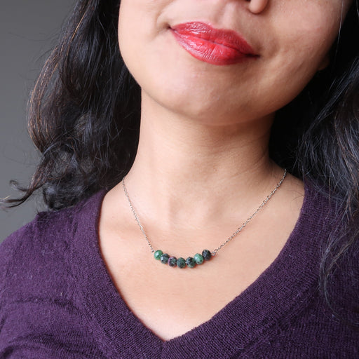 female wearing ruby zoisite necklace