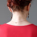 female model wearing sardonyx elephant earrings showing back