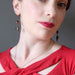 female model wearing sardonyx elephant earrings