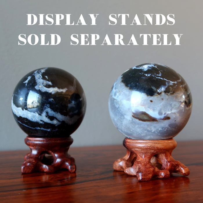 2 sardonyx spheres on wood display stands, which are sold separately