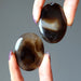 pair of black and brown sardonyx oval stones