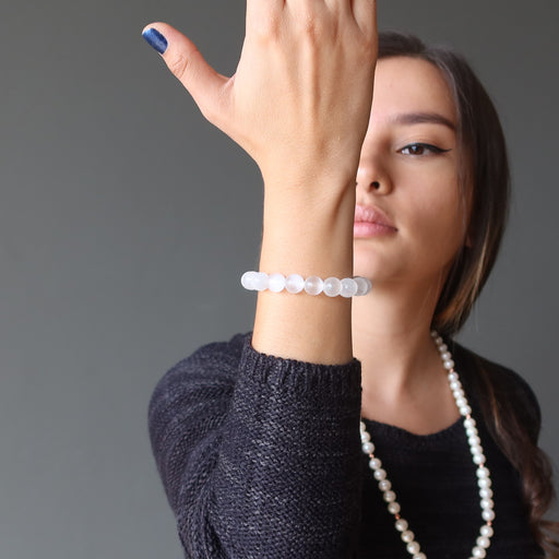 woman modeling selenite bracelet