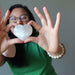 jessica of satin crystals holding a selenite heart
