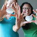 jamie and jessica of satin crystals holding white selenite hearts