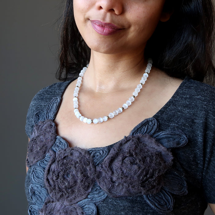 white selenite necklace on female necklace