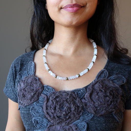woman wearing white selenite necklace
