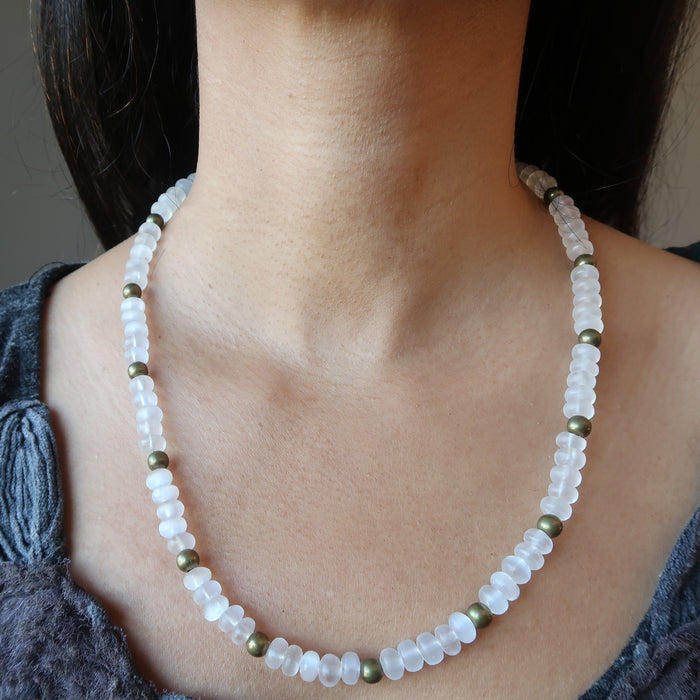 white selenite necklace on female neck