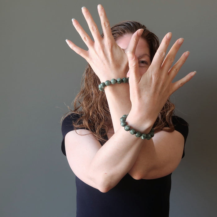 jamie of satin crystals wearing natural green seraphinite stretch bracelets