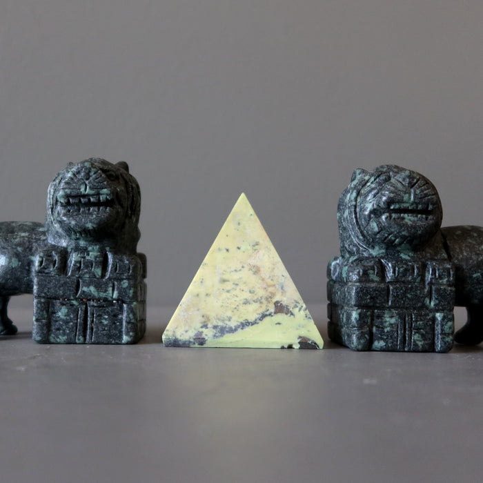 serpentine Pyramid in between green Fu Dogs