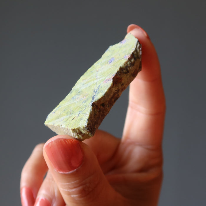 hand holding Green raw Serpentine Crystal