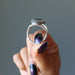hand holding up russian serpentine sterling silver adjustable ring