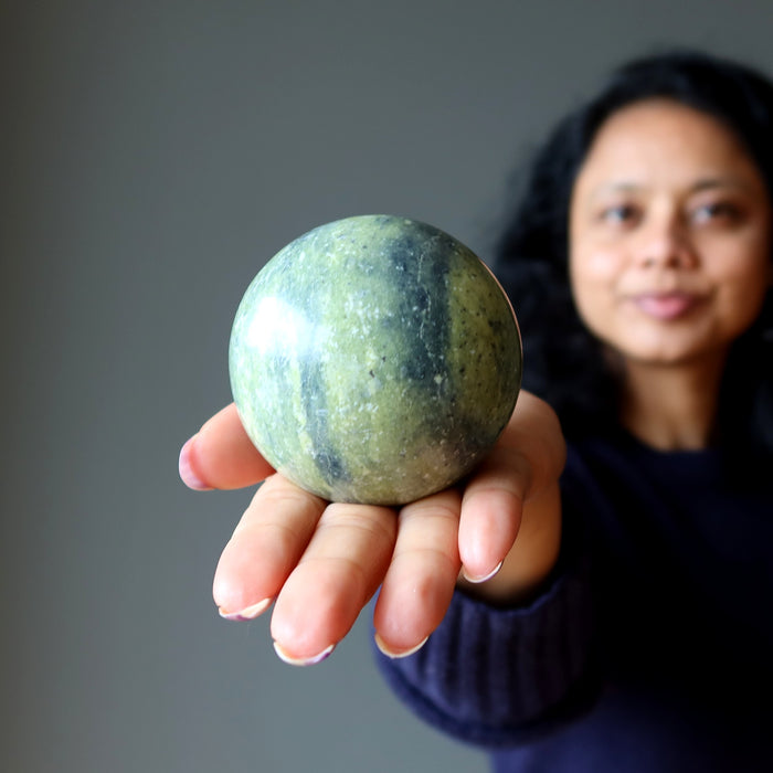 sheila holding Serpentine Sphere 