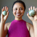 sheila of satin crystals holding two  serpentine spheres in her palms