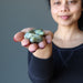 sheila holding Serpentine Tumbled Stones 