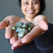 sheila holding Serpentine Tumbled Stones with both hands