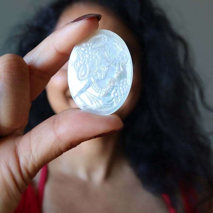female model holding Woman Flower Mother of Pearl Shell Cameo