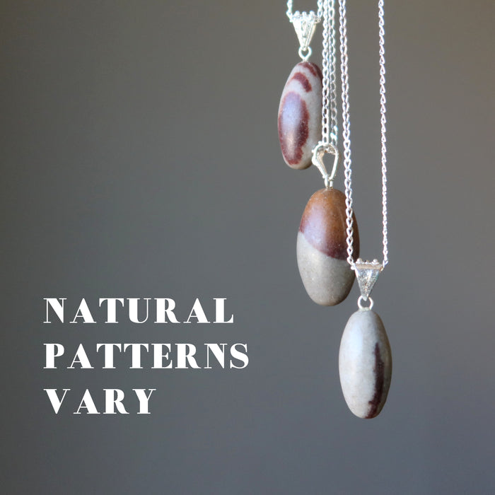 three shiva lingam necklaces showing natural patterns vary