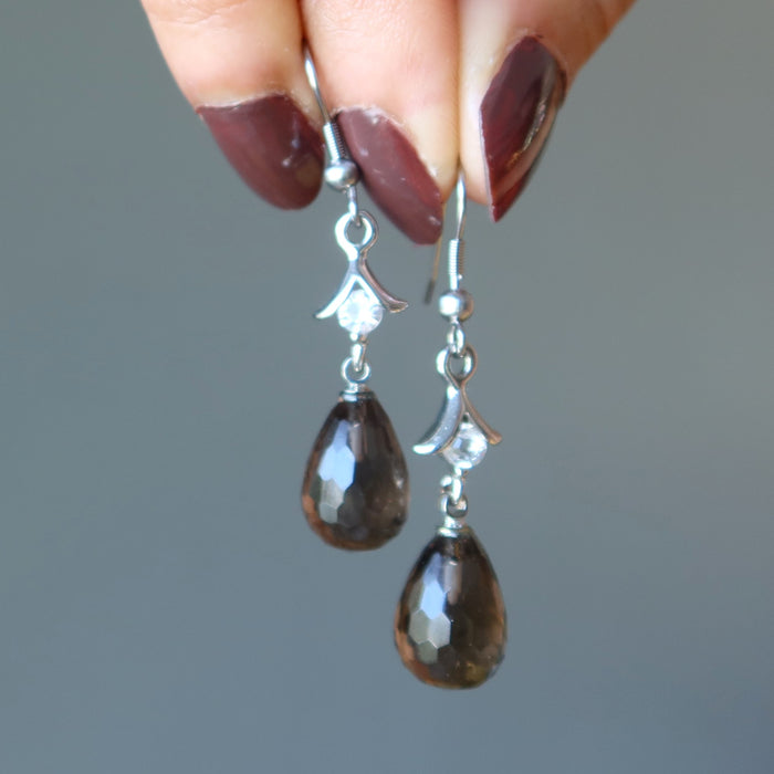 hand holding Drop Faceted Smoky Quartz hook Earrings 