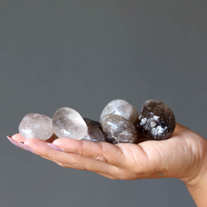 sheila of satin crystals holding Smoky Quartz Tumbled Stones 