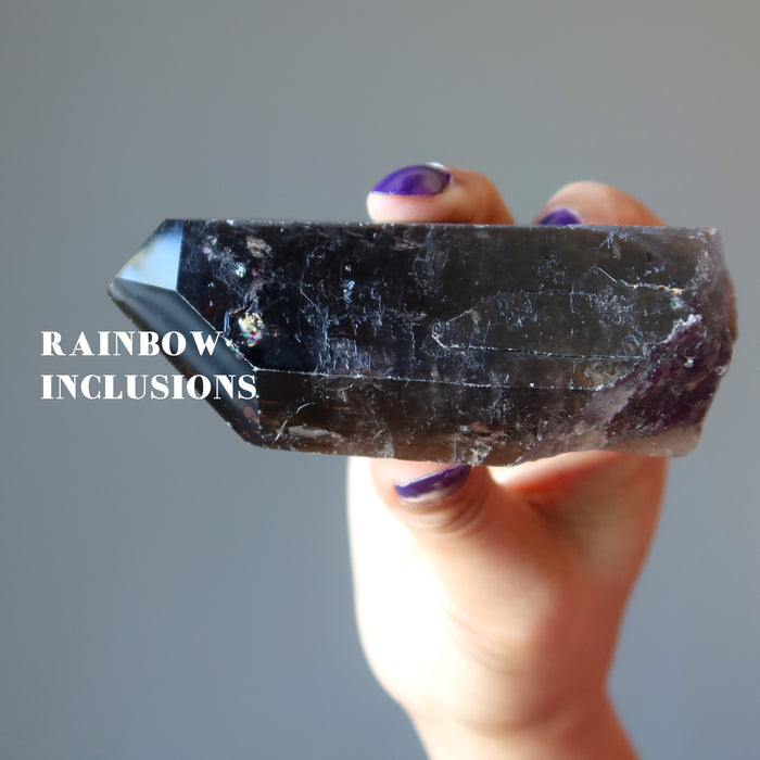 holding Smoky Quartz Point Wand showing rainbow inclusions