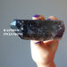 holding Smoky Quartz Point Wand showing rainbow inclusions