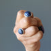 hand holding blue sodalite silver cufflinks