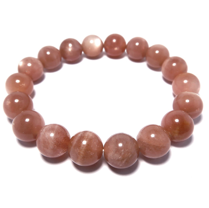 sunstone stretch bracelet with round beads of pink tone and silver sheen