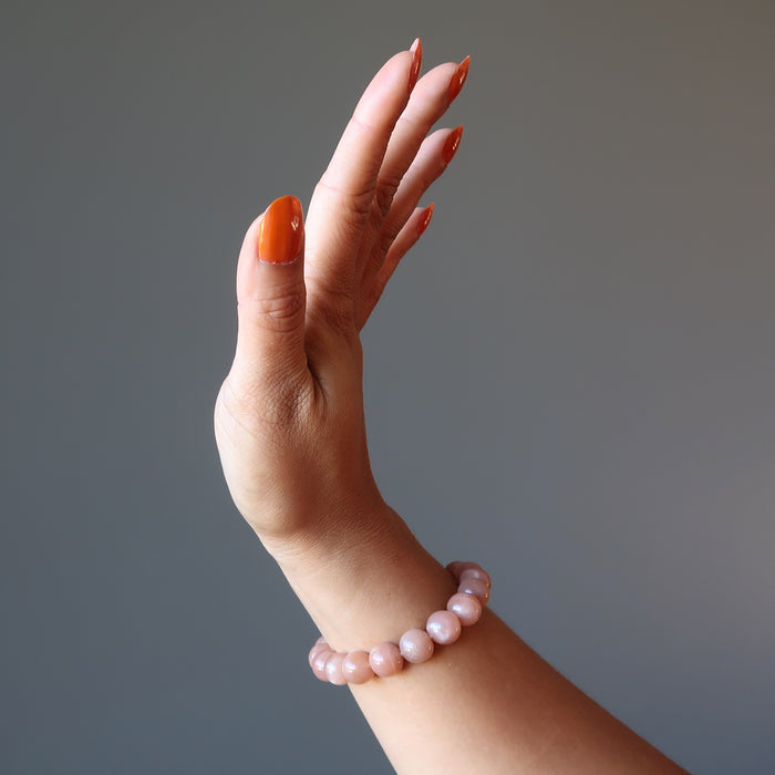 hand wearing sunstone bracelet