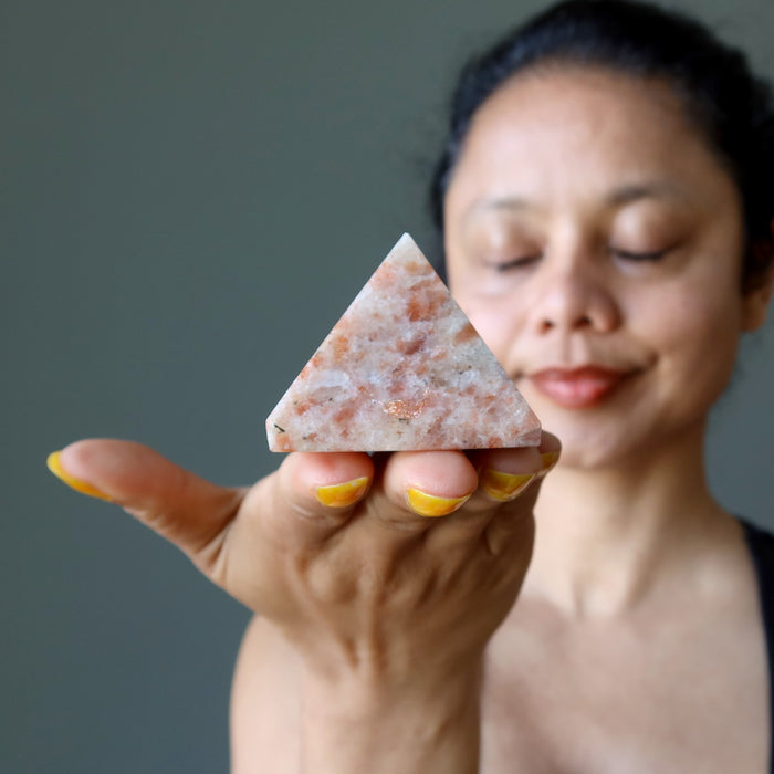 sheila of satin crystals meditating with sunstone pyramid