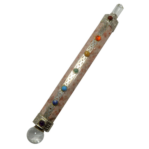 6 sides faceted Sunstone wand set between a Clear Quartz sphere and a Clear Quartz tip. The silver-plated metal features round chakra gemstones: purple Amethyst, blue Lapis Lazuli, dyed blue Magnesite, green Aventurine, yellow Agate, orange Carnelian, and Red Jasper. 