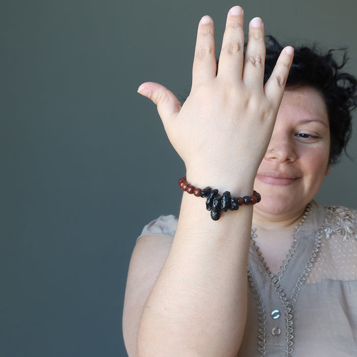 woman wearing black tektite obsidian stretch bracelet