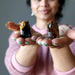sheila of satin crystals holding finger tips holding Tigers Eye Bears