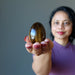 sheila holding Tigers Eye Egg on her palm