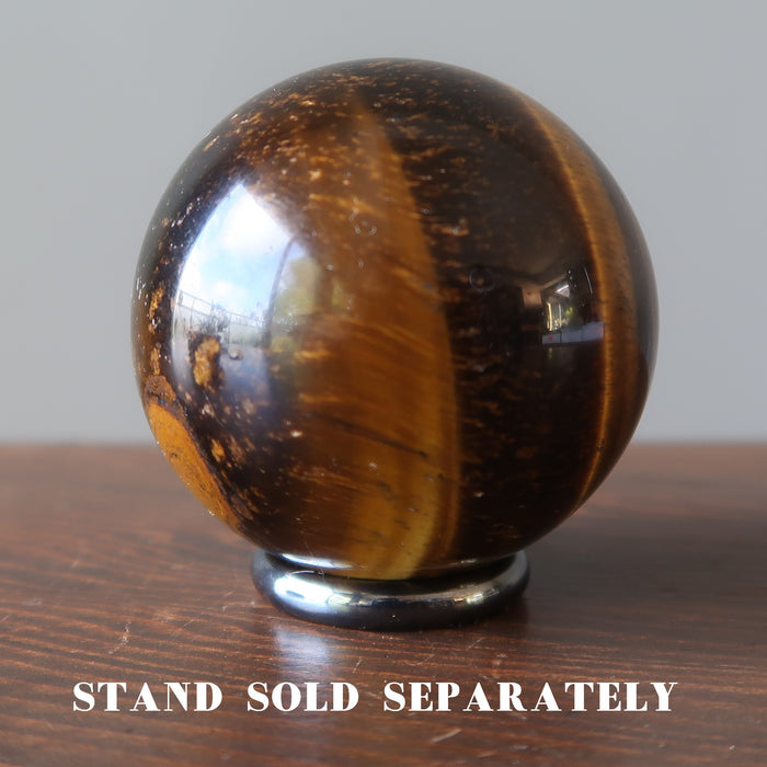tigers eye sphere on hematine ring stand which is sold separately