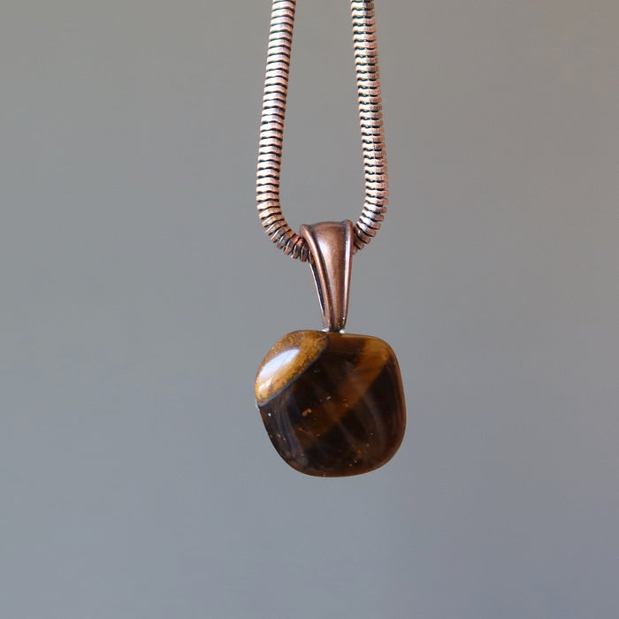 pendant view of golden brown tigers eye tumbled stone on antique copper necklace