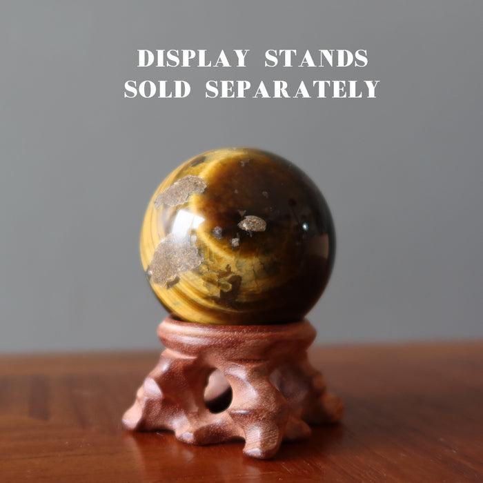 Den Muddy Earth Tigers Eye Sphere on wood stand