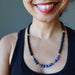 sheila of satin crystals wearing faceted black tourmaline and blue sodalite necklace