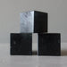 three black tourmaline cubes stacked