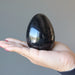 black tourmaline egg on the palm