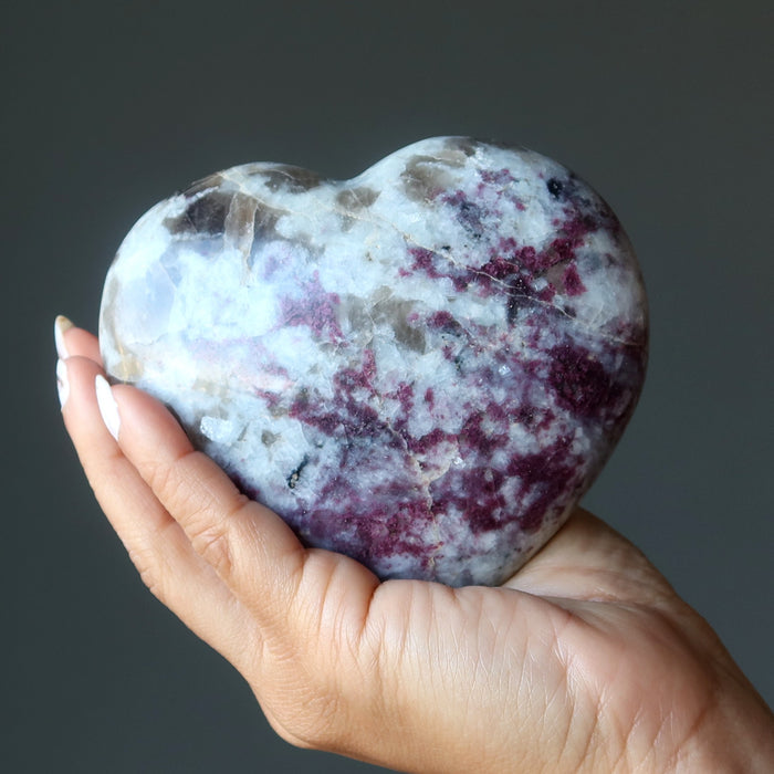 rubellite tourmaline heart in hand