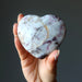rubellite tourmaline heart in hand