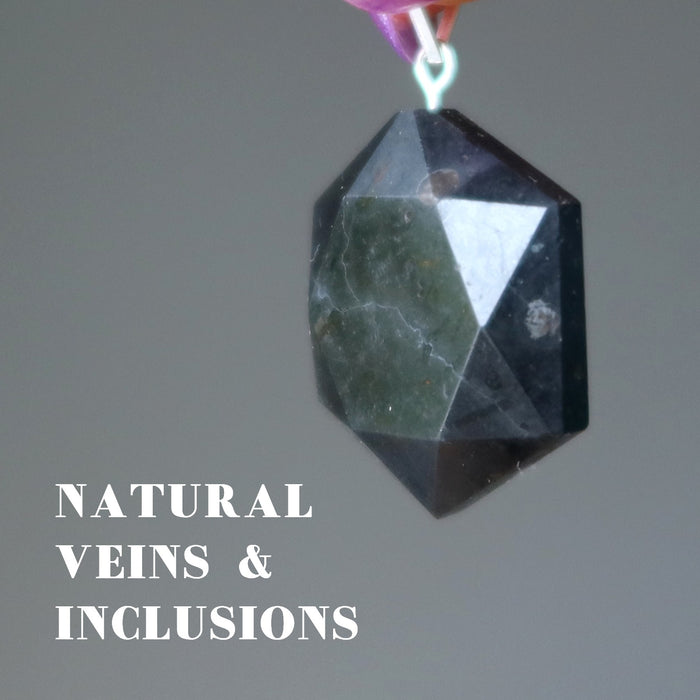 black tourmaline hexagon pendant showing natural veins and inclusions