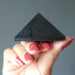 black tourmaline pyramid on hand