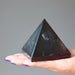 black tourmaline pyramid in hand