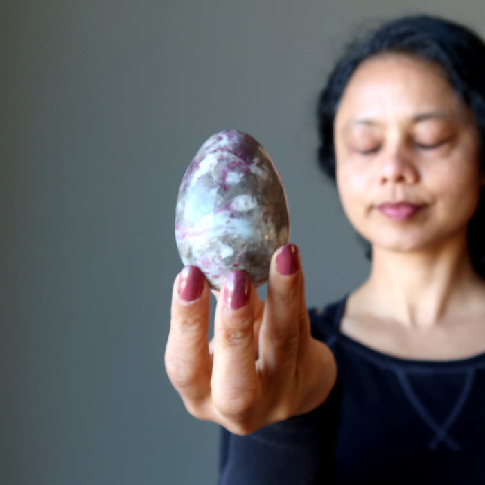 meditating with red tourmaline egg